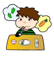 嫌いなにんじんやピーマンを浮かべながら食べ物を食べる男の子